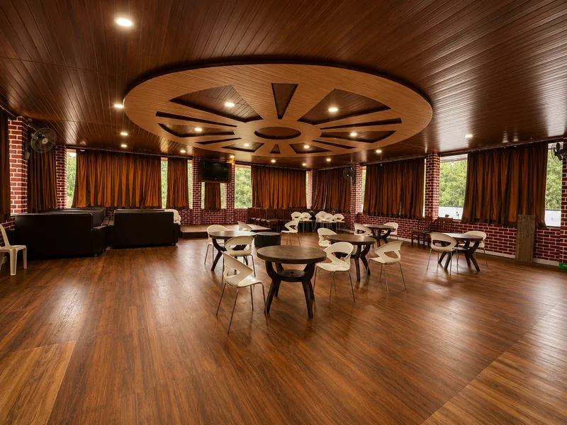 The party hall at Indavara Paradise with its carved ceiling and wooden floor